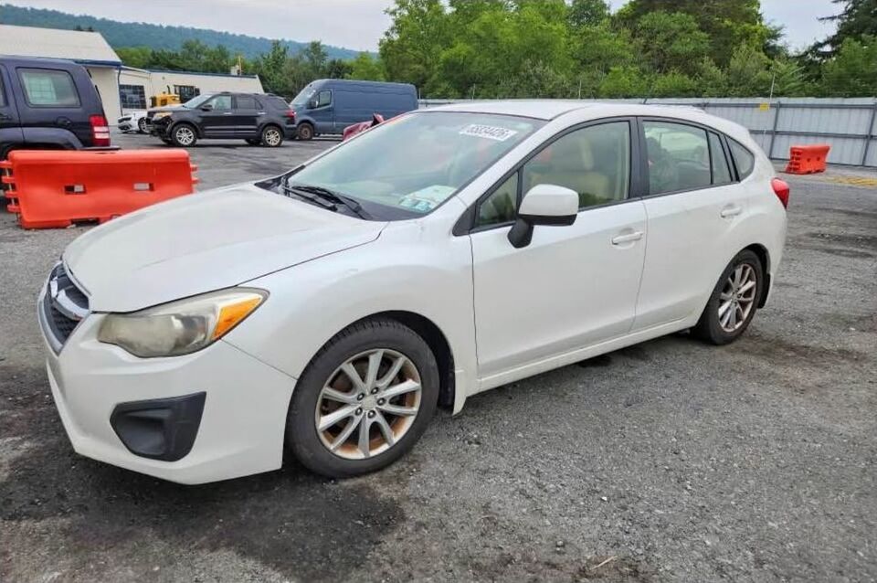White 2013 Subaru Impreza wagon being parted out